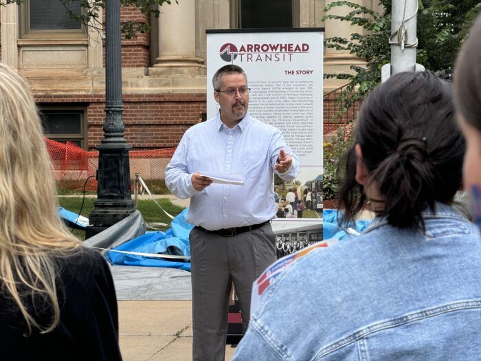 Director Brandon Nurmi speaks to the crowd about the Hibbing services offered by Arrowhead Transit.